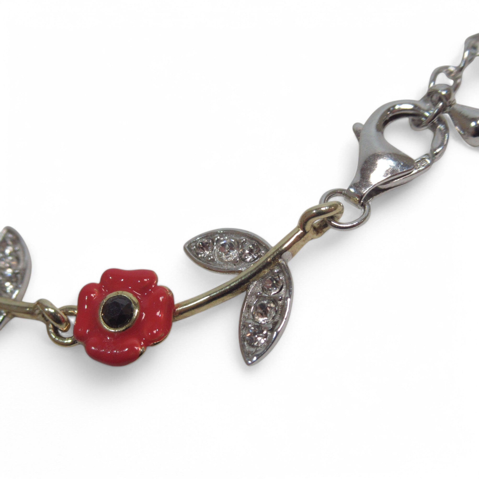 Close up image of Silver Cross Pendant & Bracelet Set w/ Poppy Design