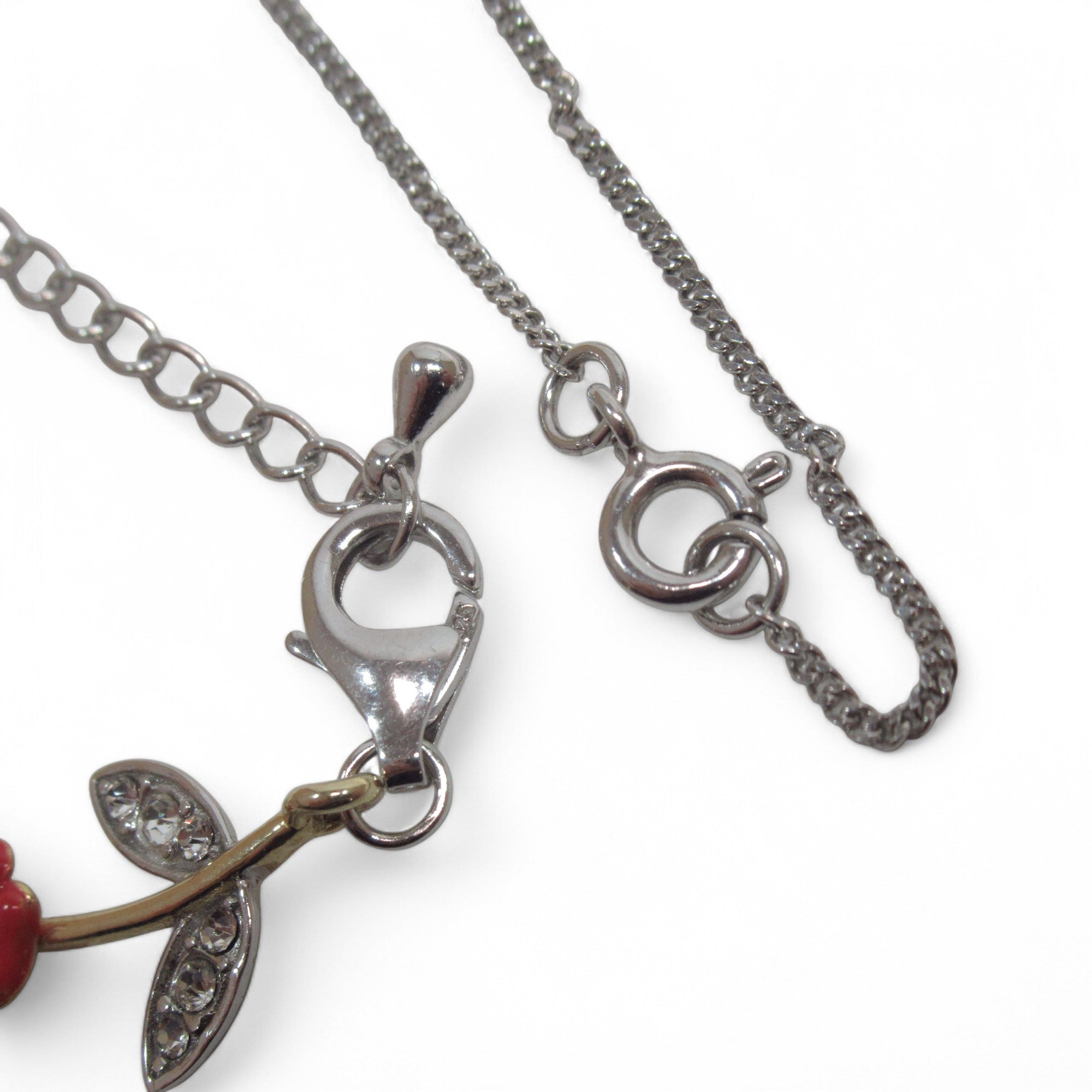 Close up closures of Silver Cross Pendant & Bracelet Set w/ Poppy Design