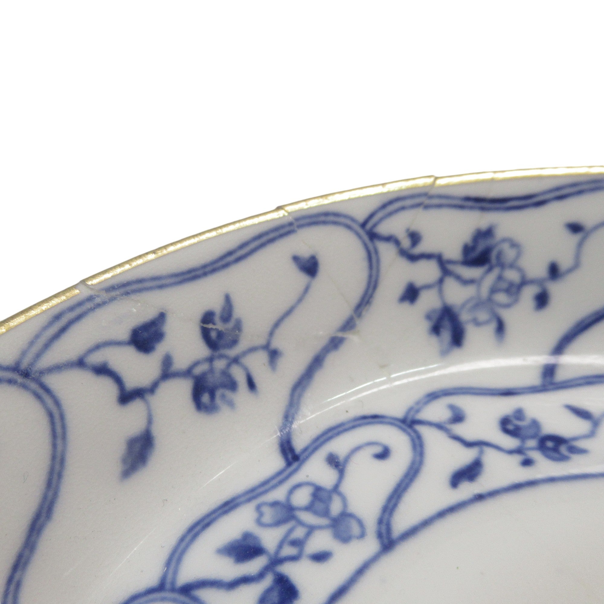 Close up of repair of Mintons Cup & Saucer No. 29993 Floral Pattern Blue/White