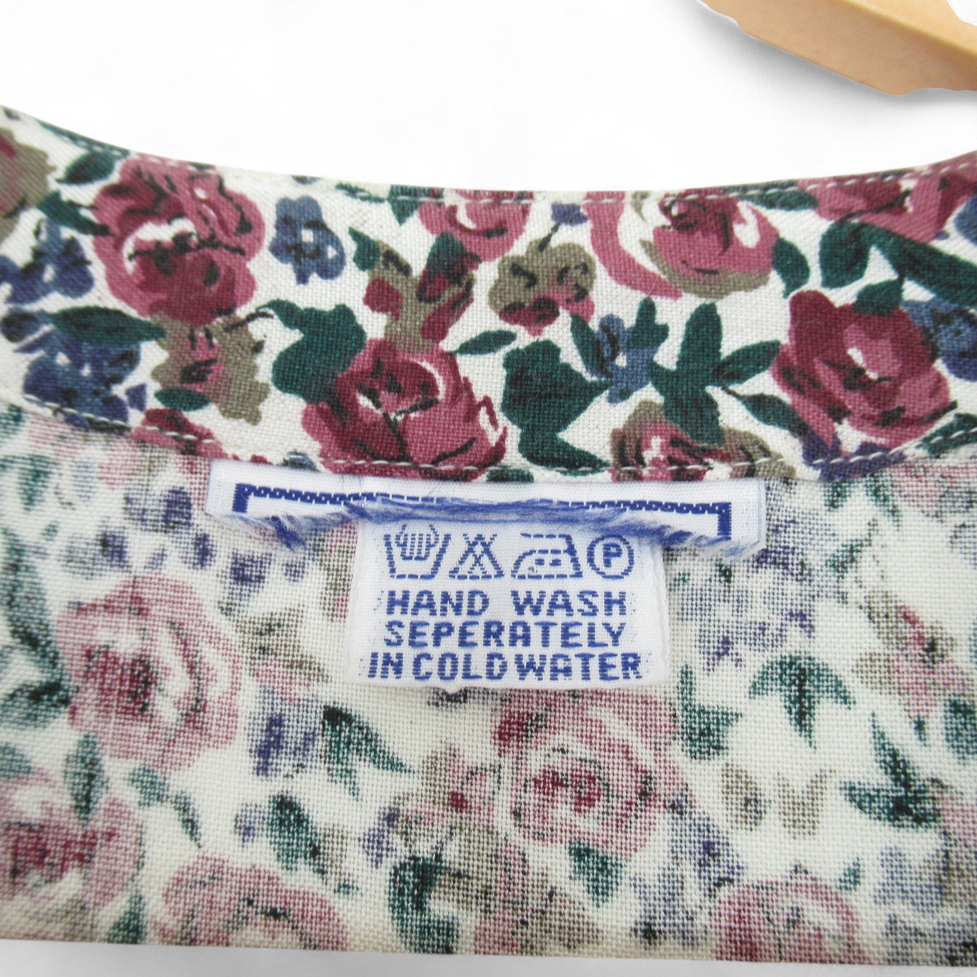 care label image for Vintage Floral Blouse Shirt Medium Purple Womenswear | Pre-loved