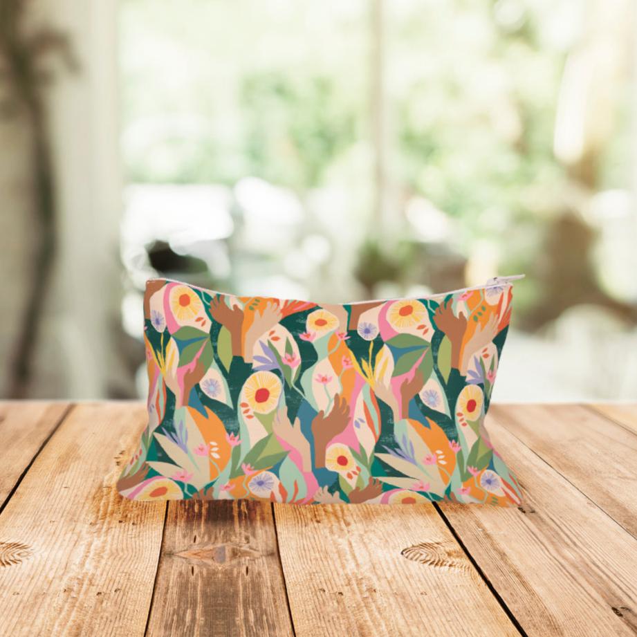 Front image of Exclusive Cosmetic Case bottle designed by artist Lily Windsor Walker on wooden table
