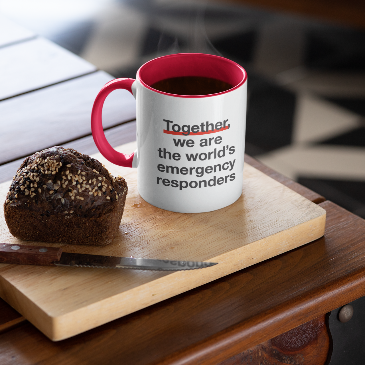 Mug with text on a wooden cutting board with a muffin
