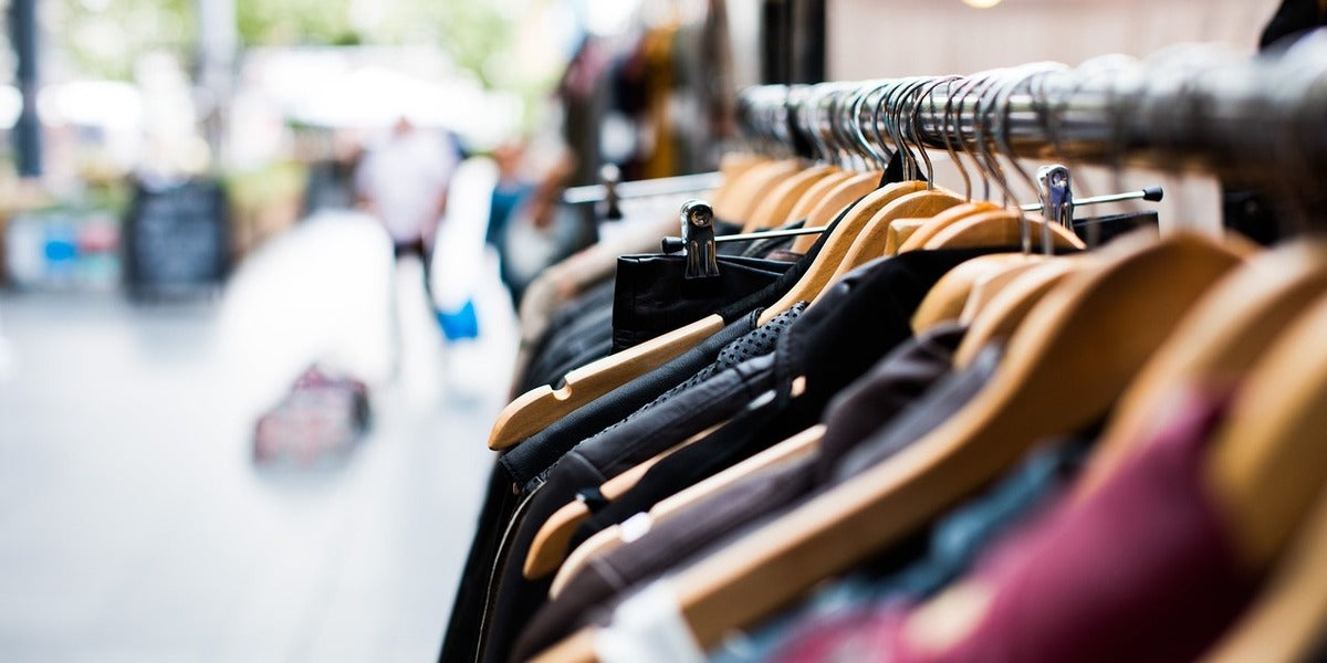 A row of second-hand clothes outside a charity shop