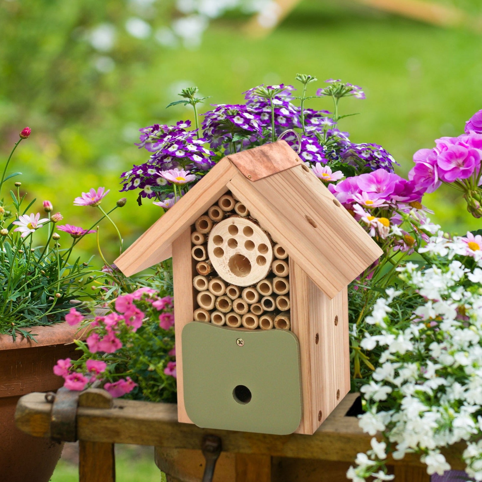 Front image of Artisan Bee Barn surrounded by flowers