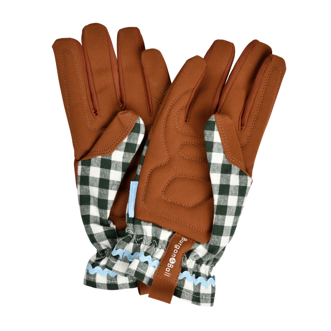 Pair of brown leather gloves with checkered cuffs on a white background