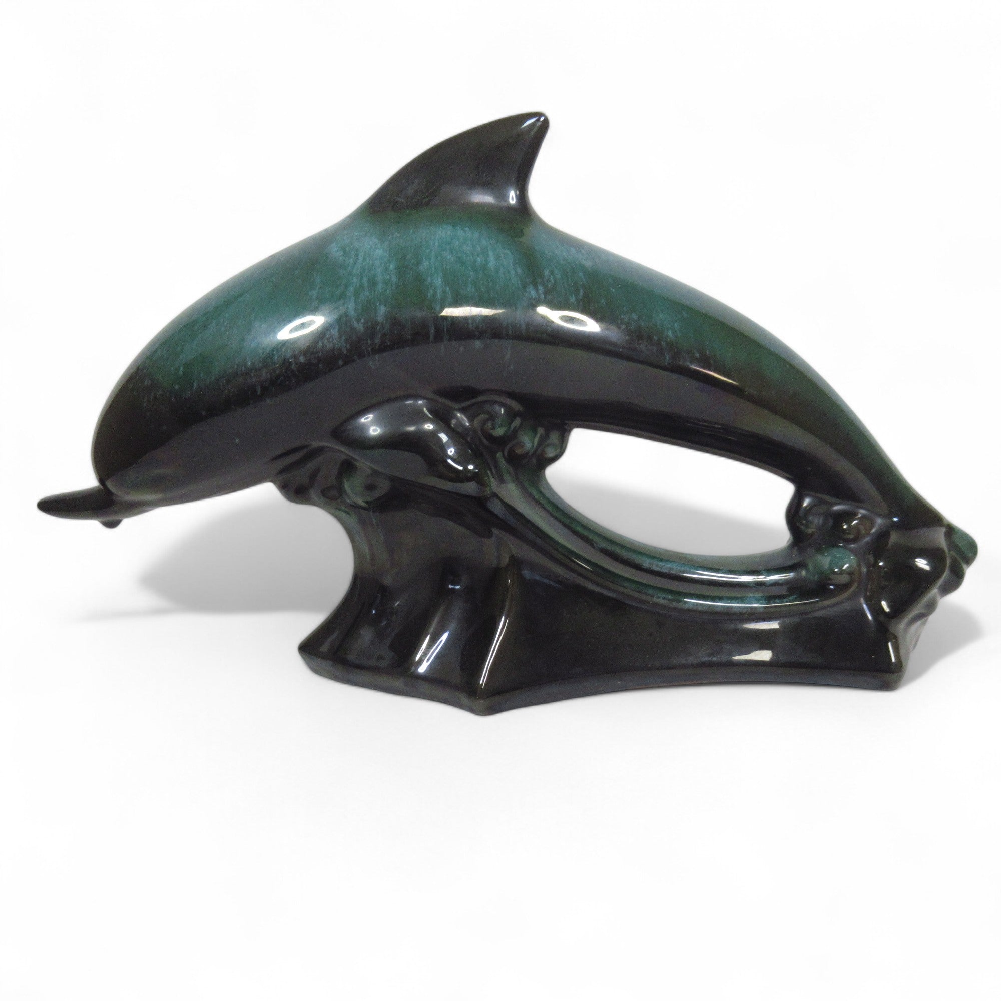 Side view image of Blue Mountain Pottery Teal Green Wave Jumping Dolphin
