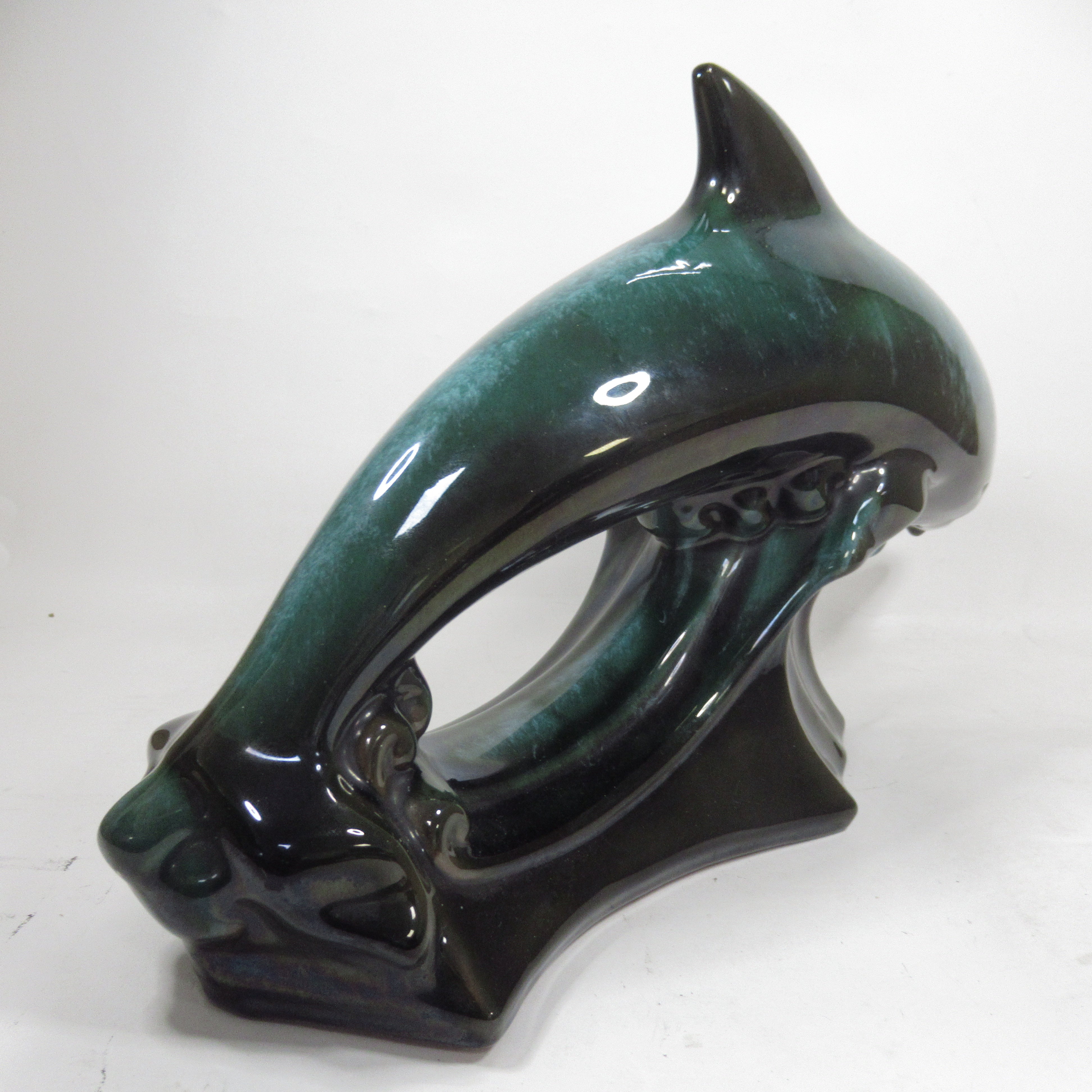 Rear image of Blue Mountain Pottery Teal Green Wave Jumping Dolphin