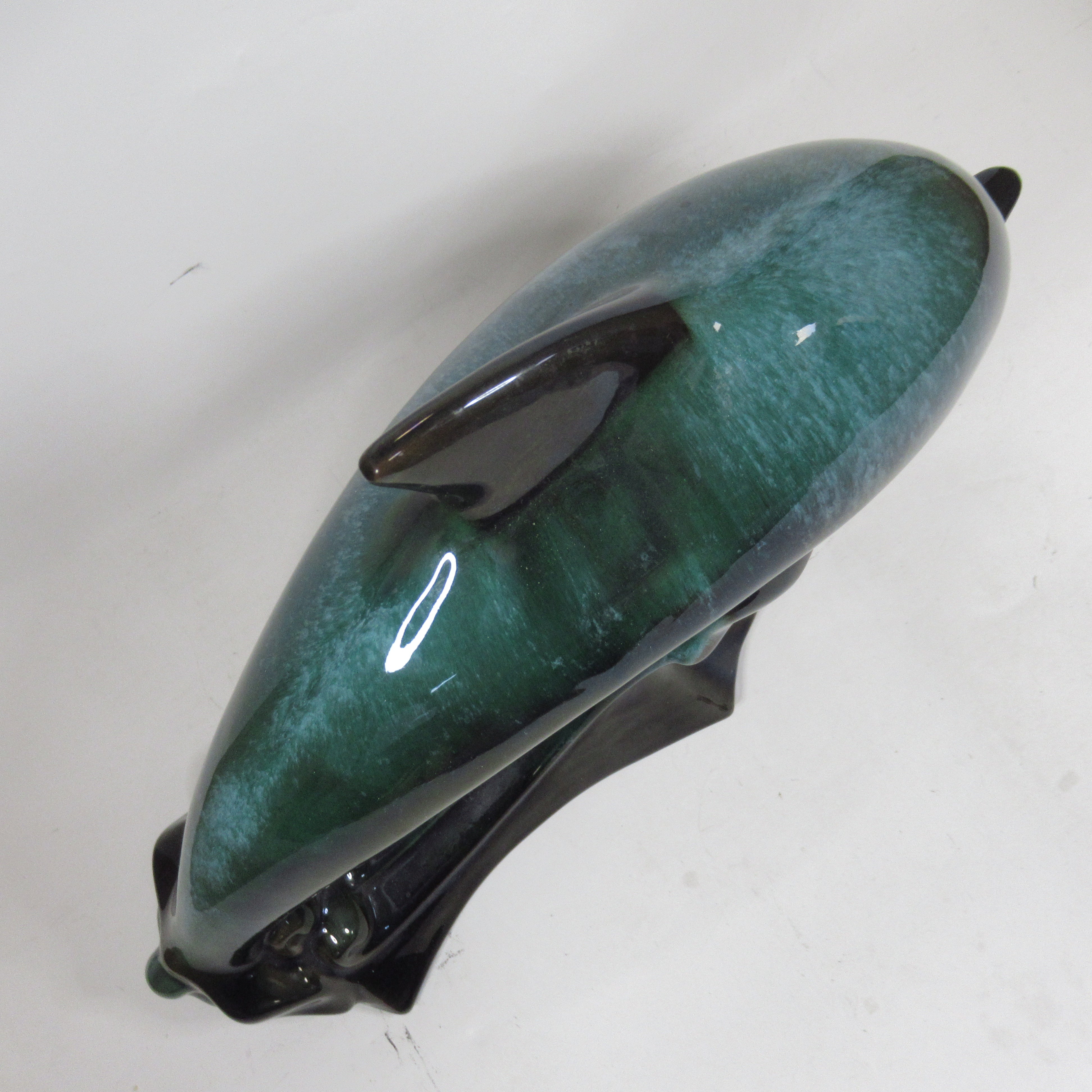 Top image of Blue Mountain Pottery Teal Green Wave Jumping Dolphin