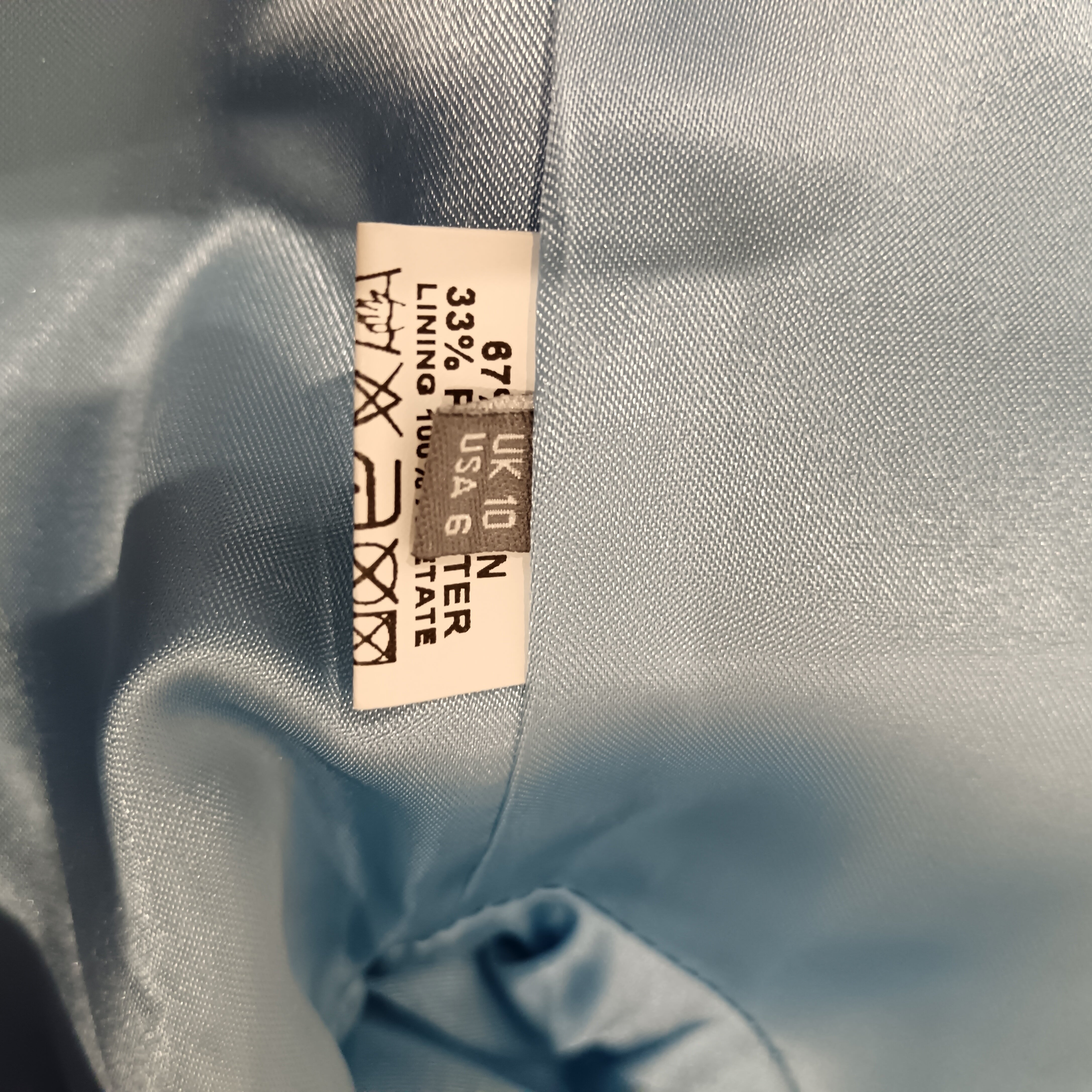 Wash label image for Pale Blue With Pearl Neckline Dress & Jacket BY Michaela Louisa  UK 10 Womenswear | Pre-loved