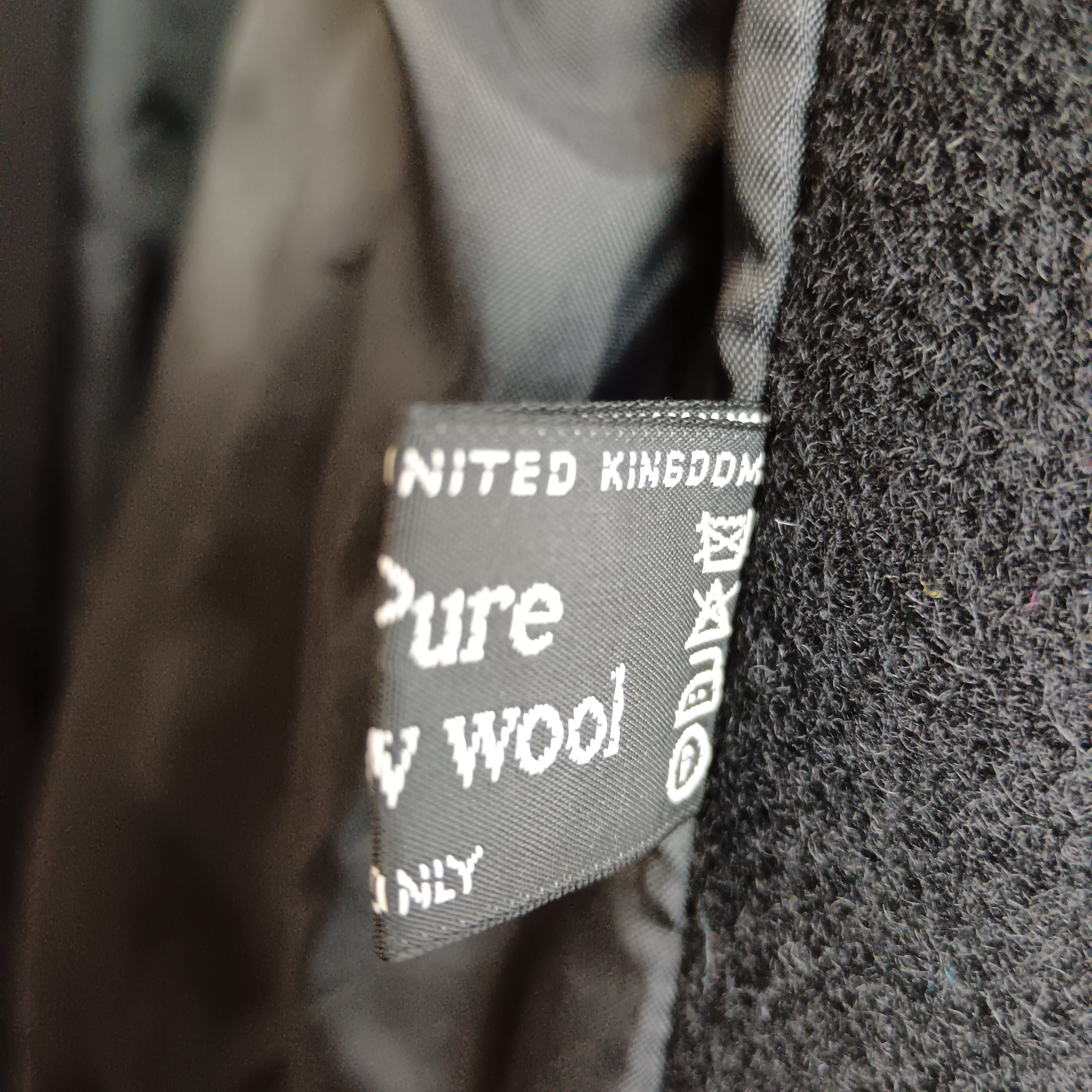 Wash label image for Unbranded Pure Wool Ladies Mid Length Black Coat UK Medium- Womenswear | Pre-loved