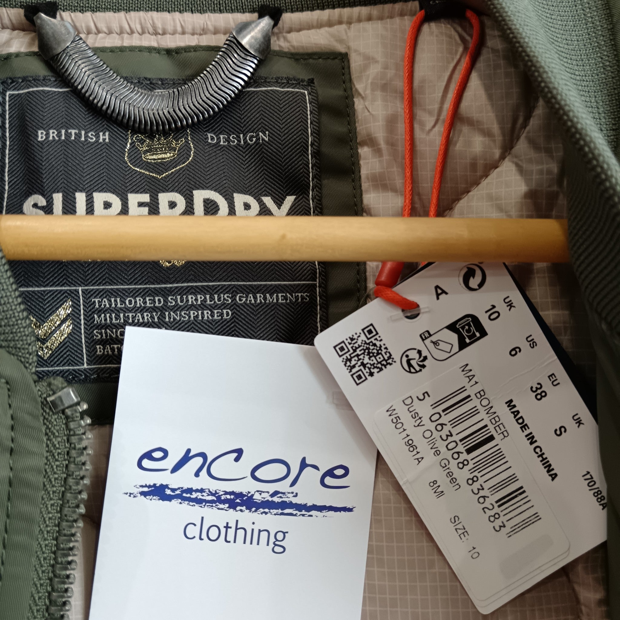 Brand label /product info image for Superdry Military Inspired Ladies Dusty Olive Green Coat UK 10 -Tags On - Womenswear | Pre-loved