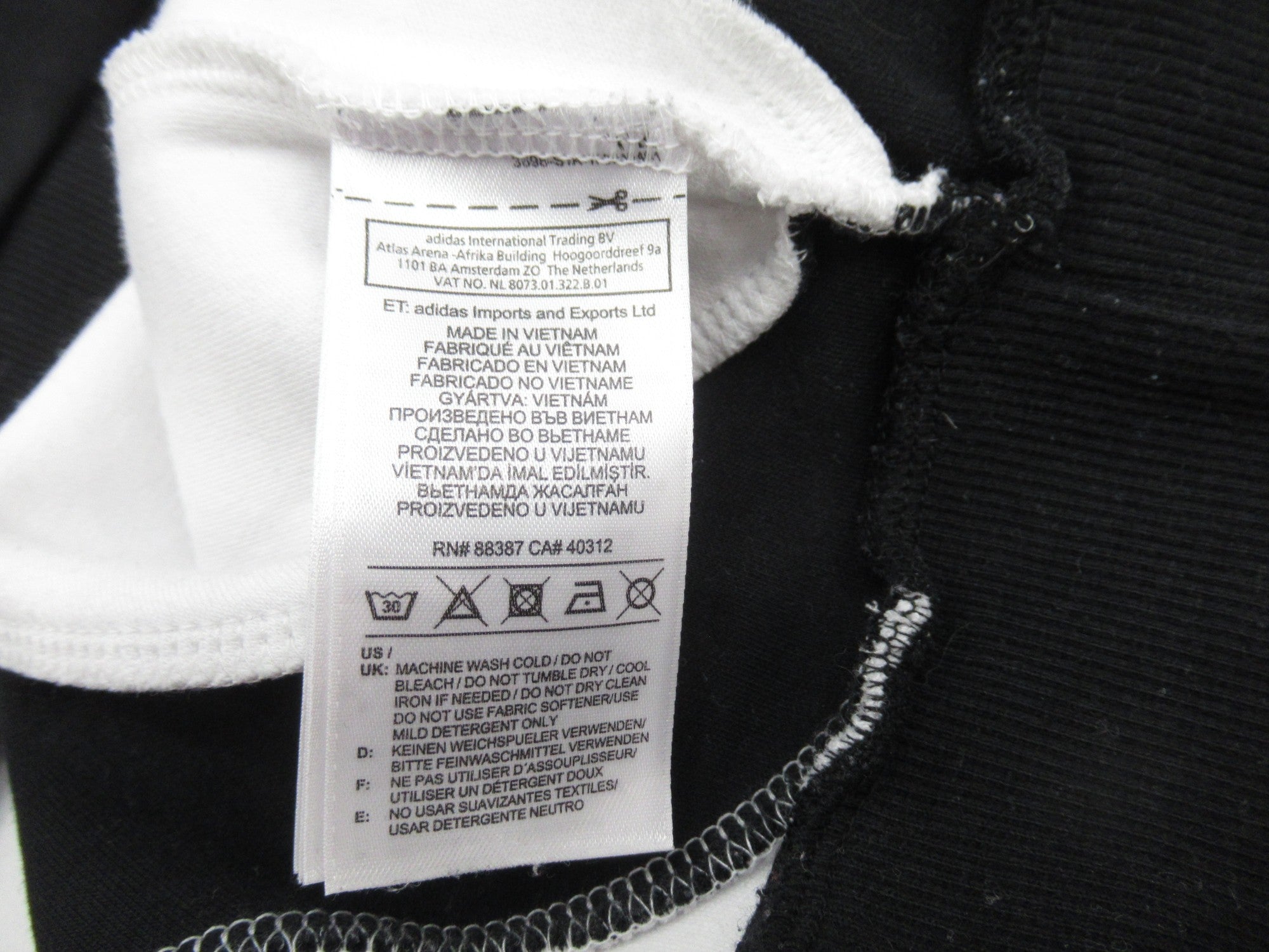 Care label image for Adidas Black White Large Hoodie Menswear | Preloved 