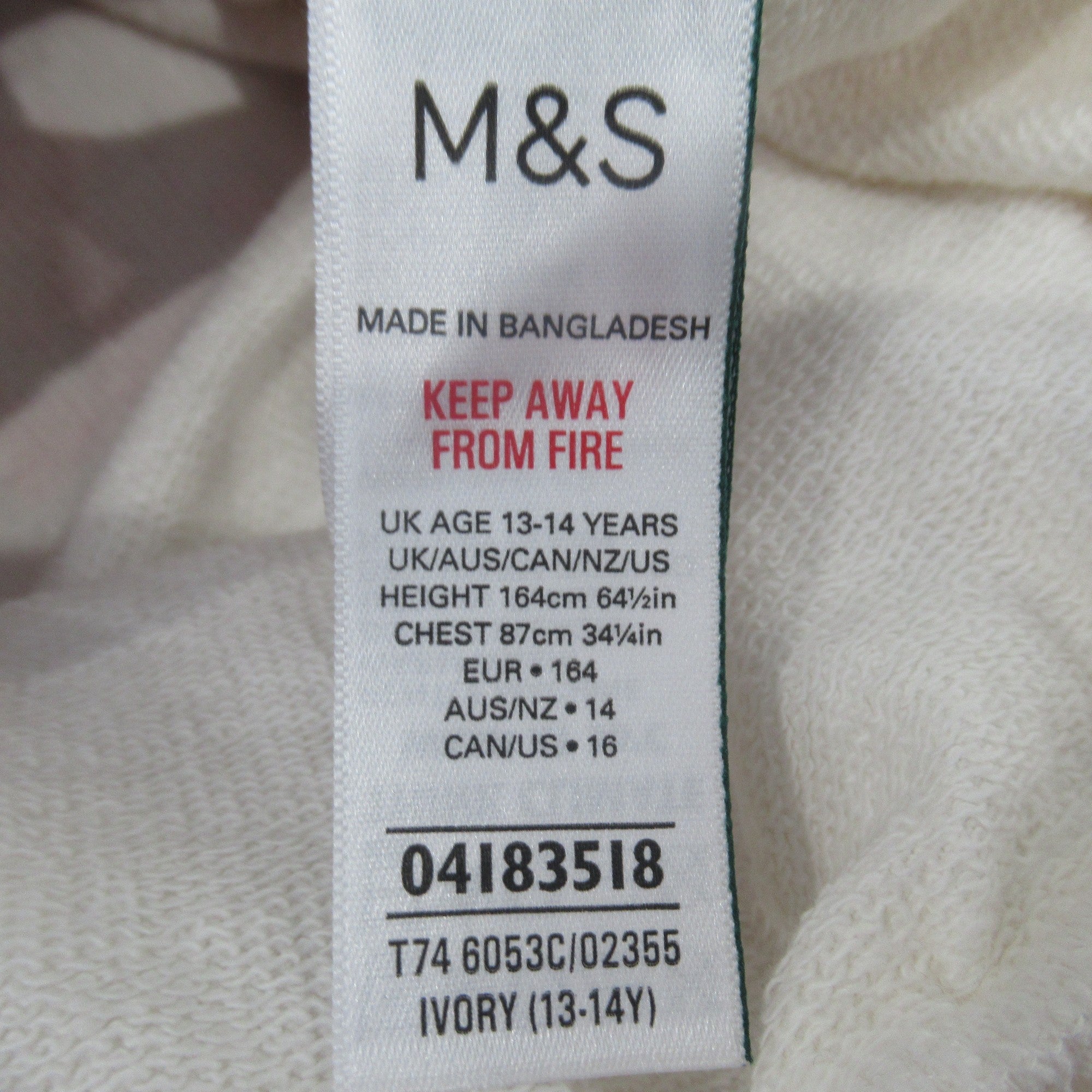 care label image for M & S 13-14 years Mickey Mouse Sweater Ivory Cotton | Preloved