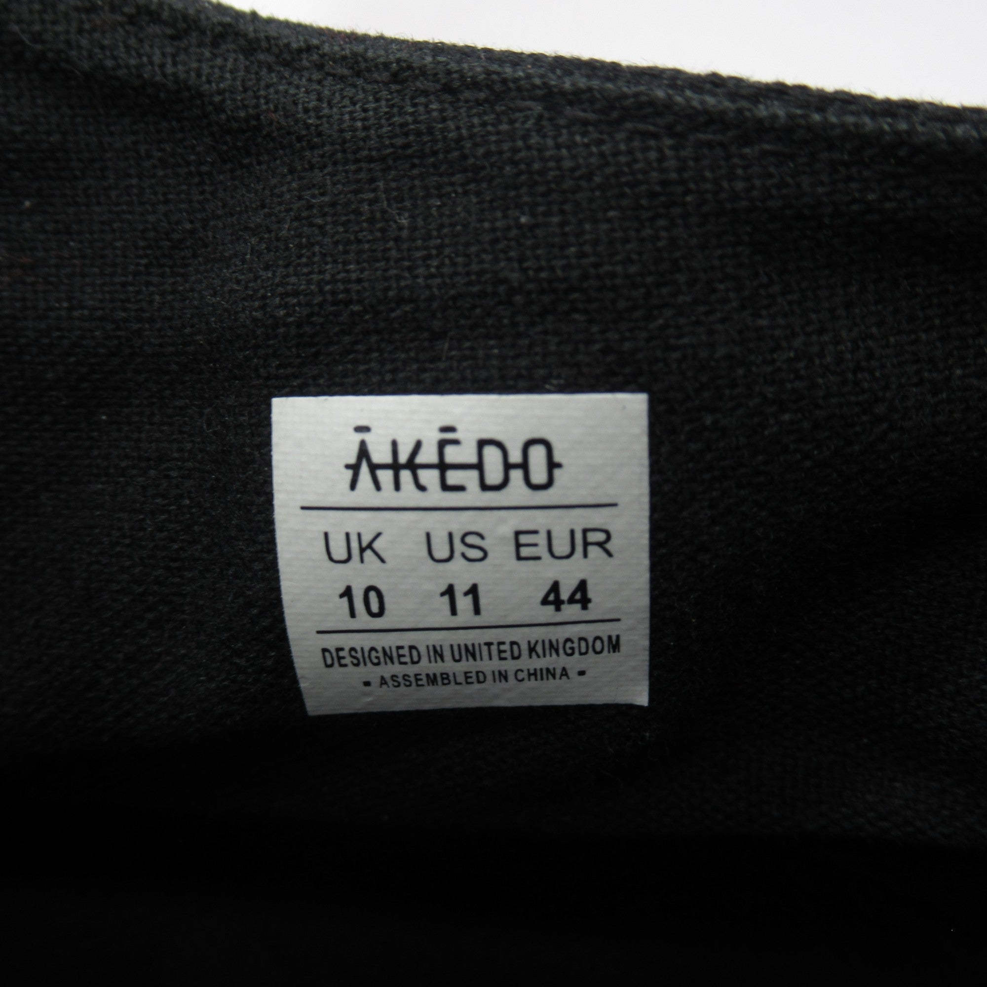 Size label for Akedo Pokemon UK 10 Black High Tops Trainers Menswear 