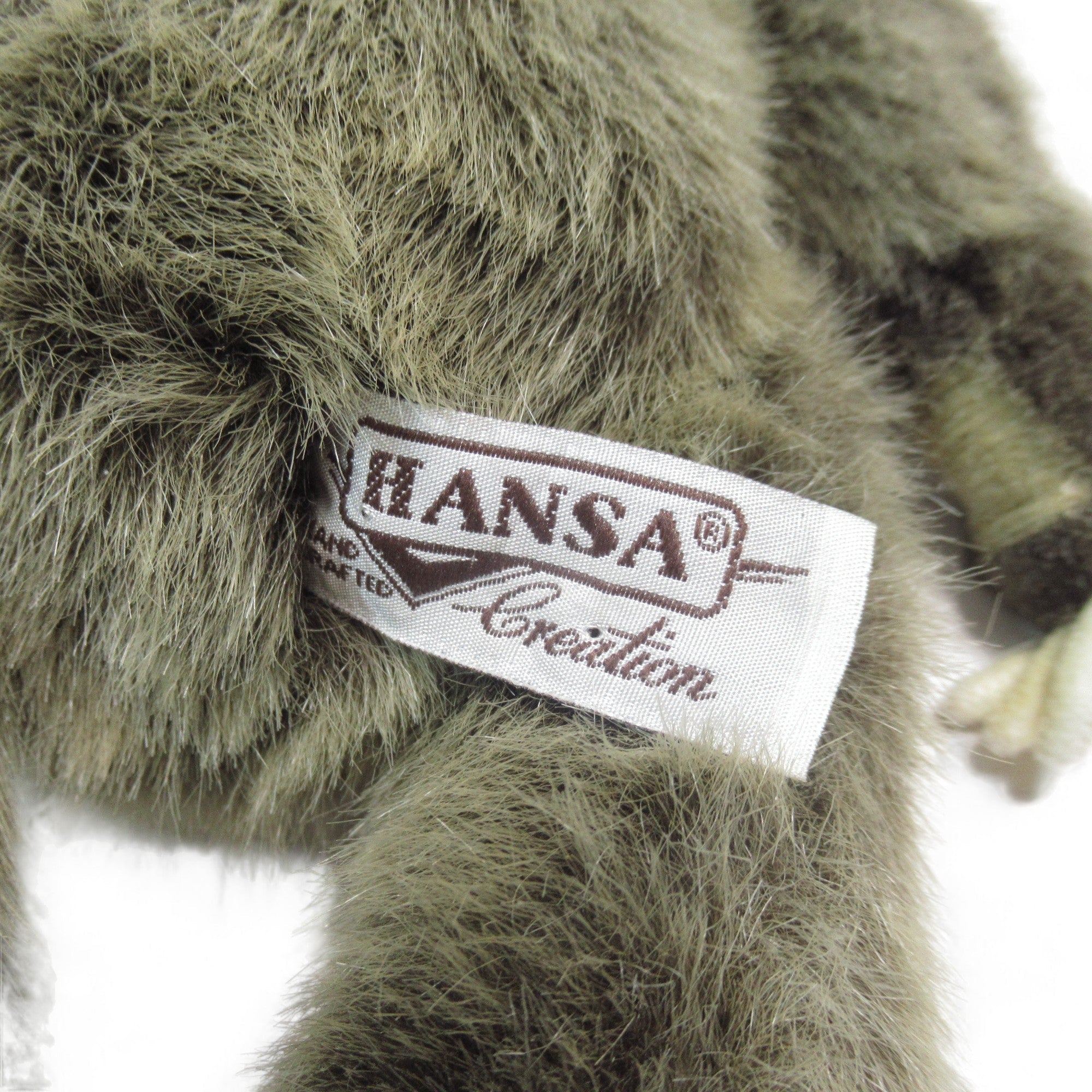 Close up tag image of HANSA Creation Sloth Soft Toy Articulated