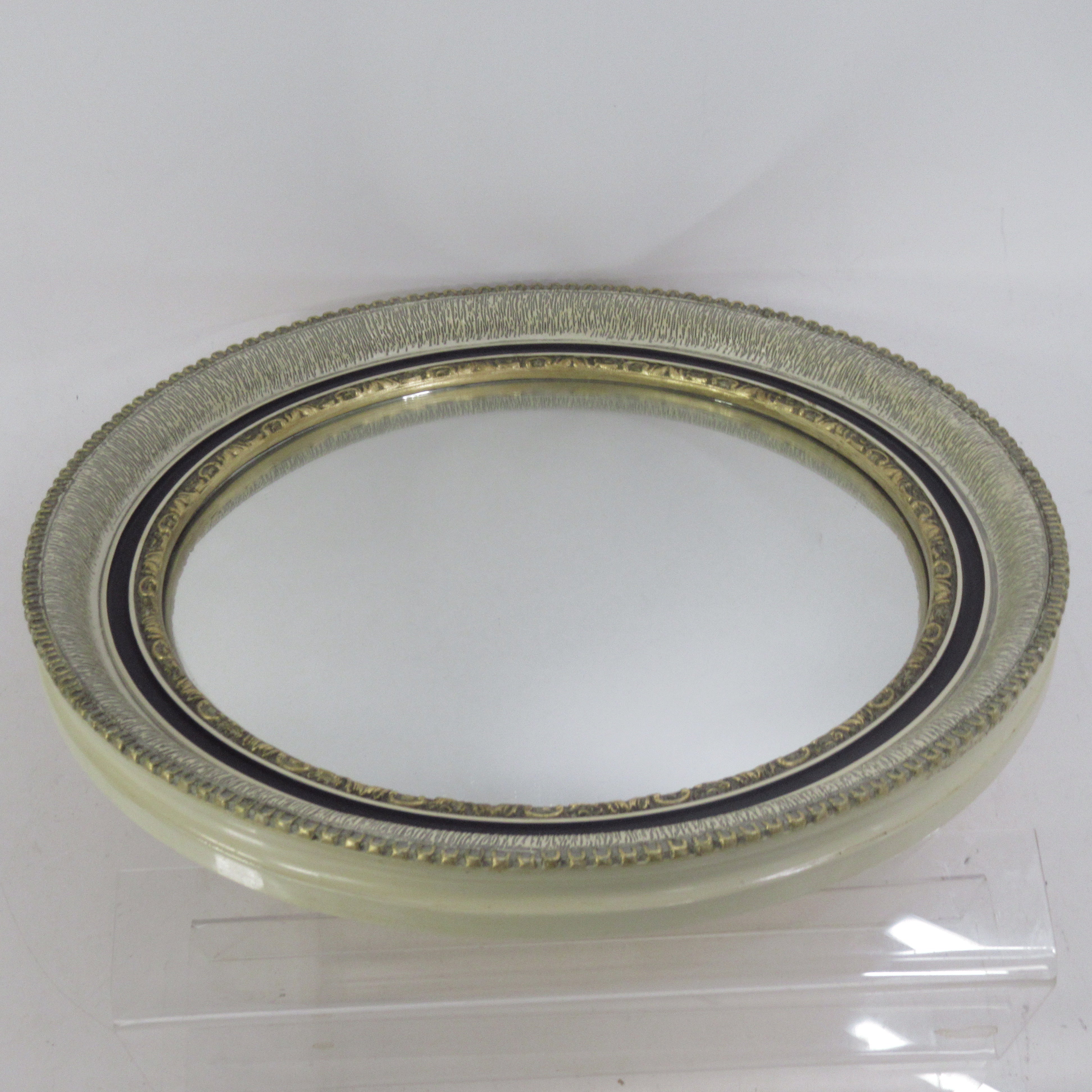 Front image of Atsonea Oval Wall Mirror with Ornate Trim