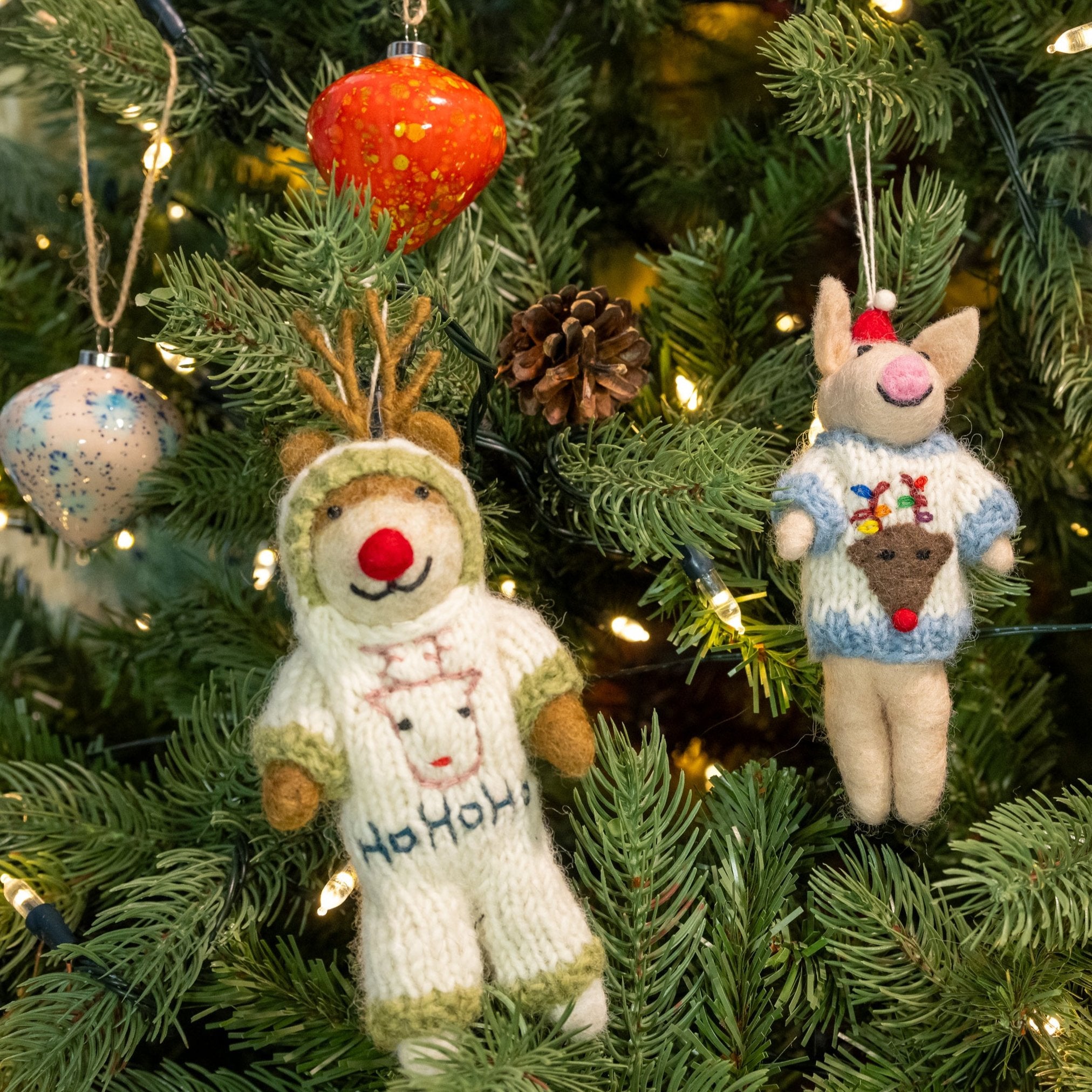 Image of Reindeer in Onesie Handmade, Pig in jumper & two baubles on a Christmas tree