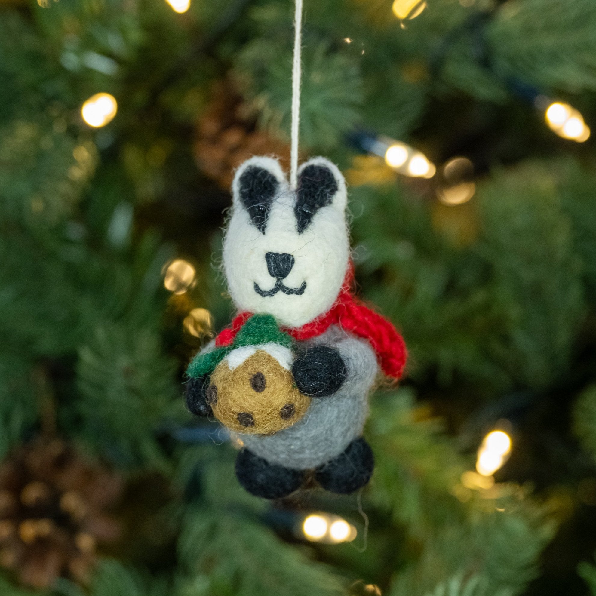 Front view of Badger with Christmas Pudding handmade felt decoration