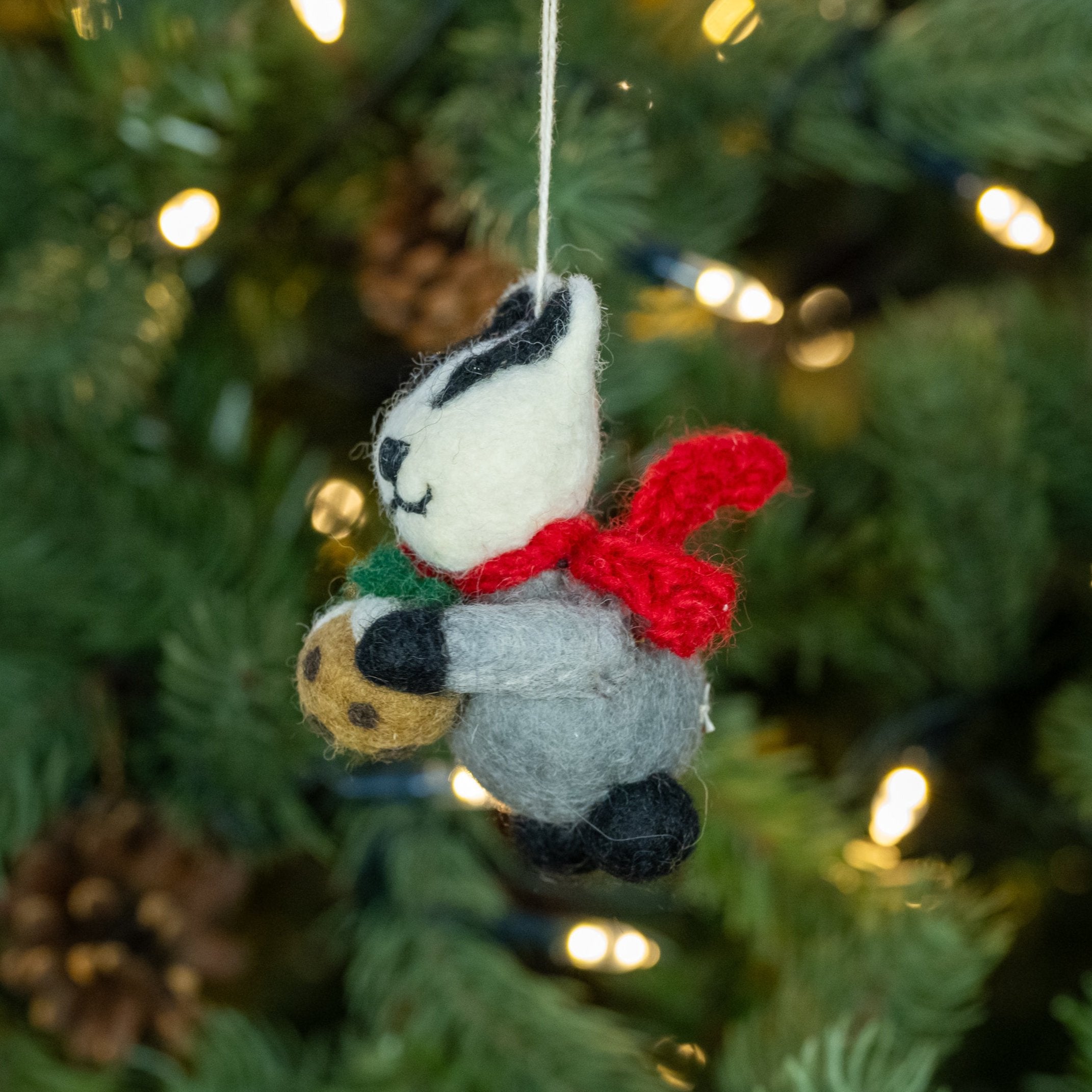 Side view of Badger with Christmas Pudding handmade felt decoration